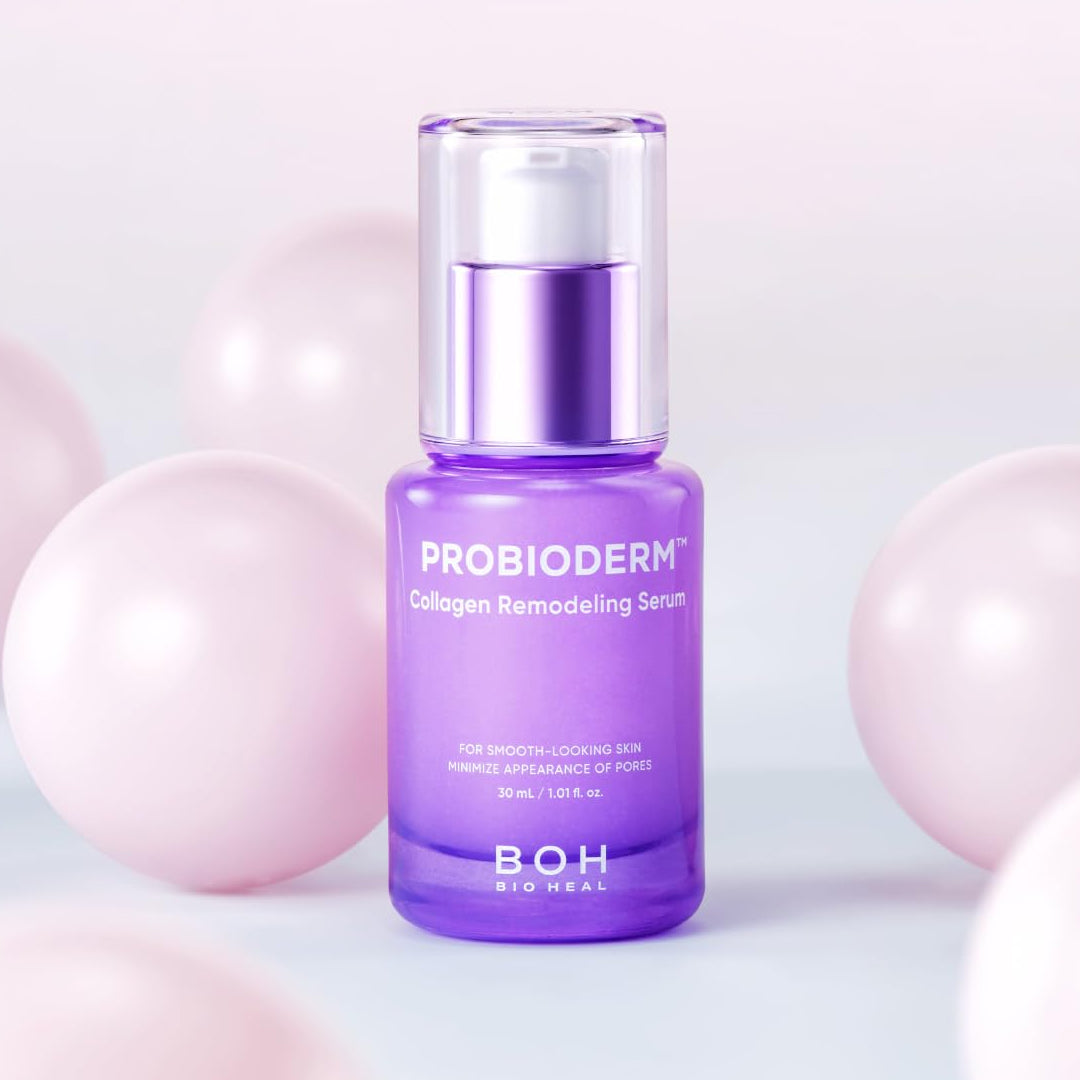 BOH Probioderm Collagen Remodeling Serum in a sleek purple 30ml bottle, standing among soft pink pearls on a pastel background, promoting smooth-looking skin and minimized pores.