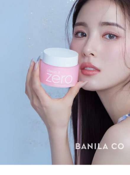woman holding pink banila co cleansing balm