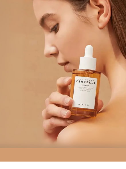 woman holding skin1004 centella serum - bellubeauty