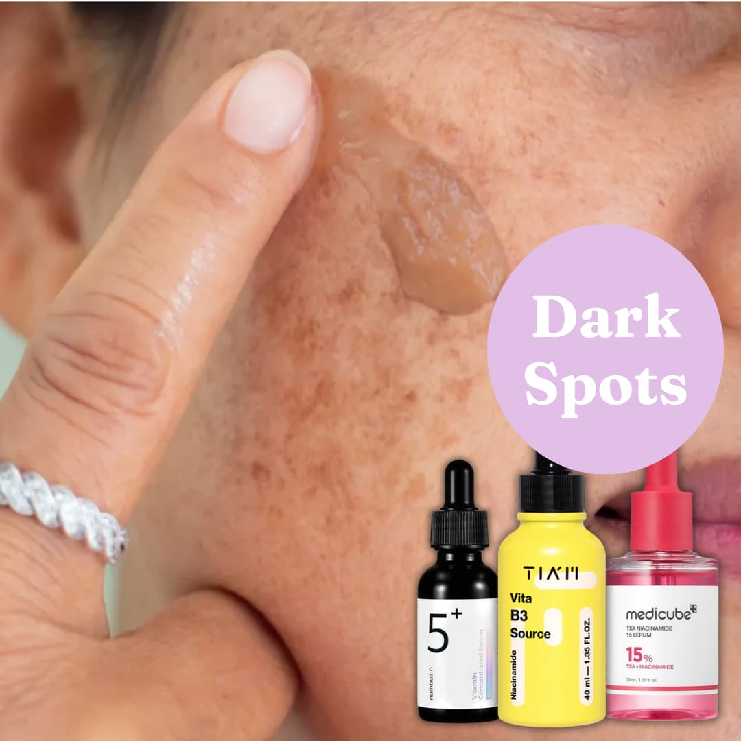 Close-up of skin with dark spots, three skincare bottles, and a purple circle labeled Dark Spots