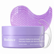 Biodance Caviar PDRN Eye Patches in a lavender jar with three translucent purple patch sheets fanned behind it on a white background.