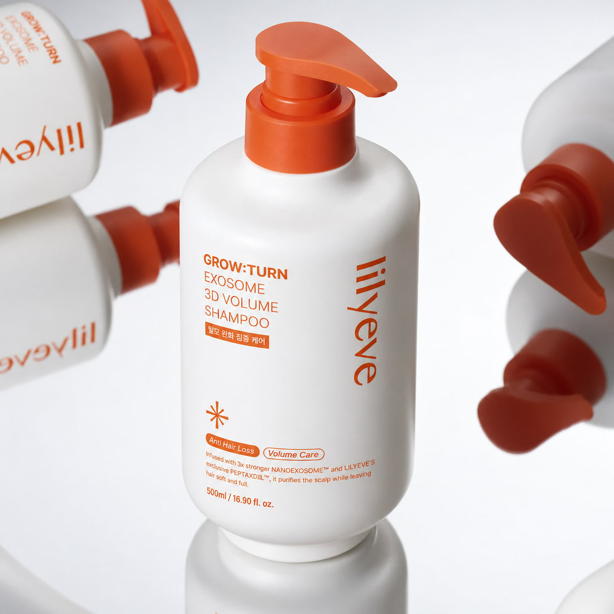 LILYEVE Grow Turn Exosome 3D Volume Shampoo 500ml in a white bottle with an orange pump, surrounded by matching shampoo bottles against a clean white background.