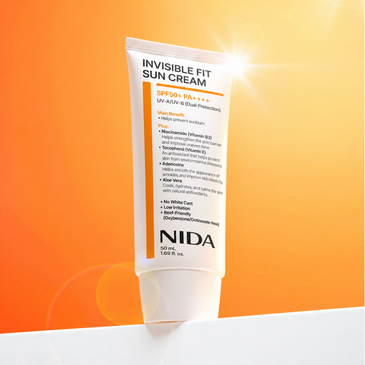 A 50 mL squeeze tube of NIDA Invisible Fit Sun Cream SPF50+ PA++++ upright against a bright orange and yellow gradient background with a sunburst effect.