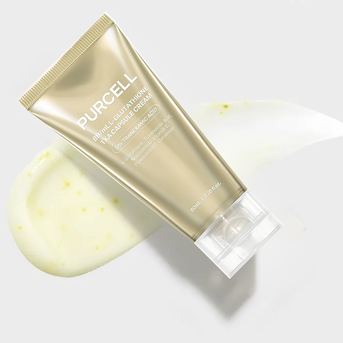 PURCELL 8B/mL L-Glutathione TXA Capsule Cream in a metallic gold squeeze tube, shown diagonally over a dollop of pale yellow cream on a light gray background.