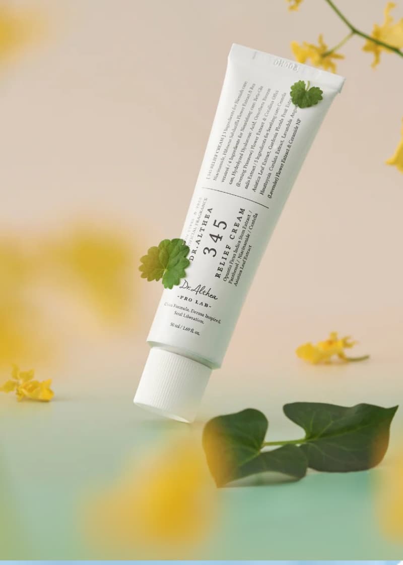 Tube of dr althea korean skincare with green leaves and flowers in background