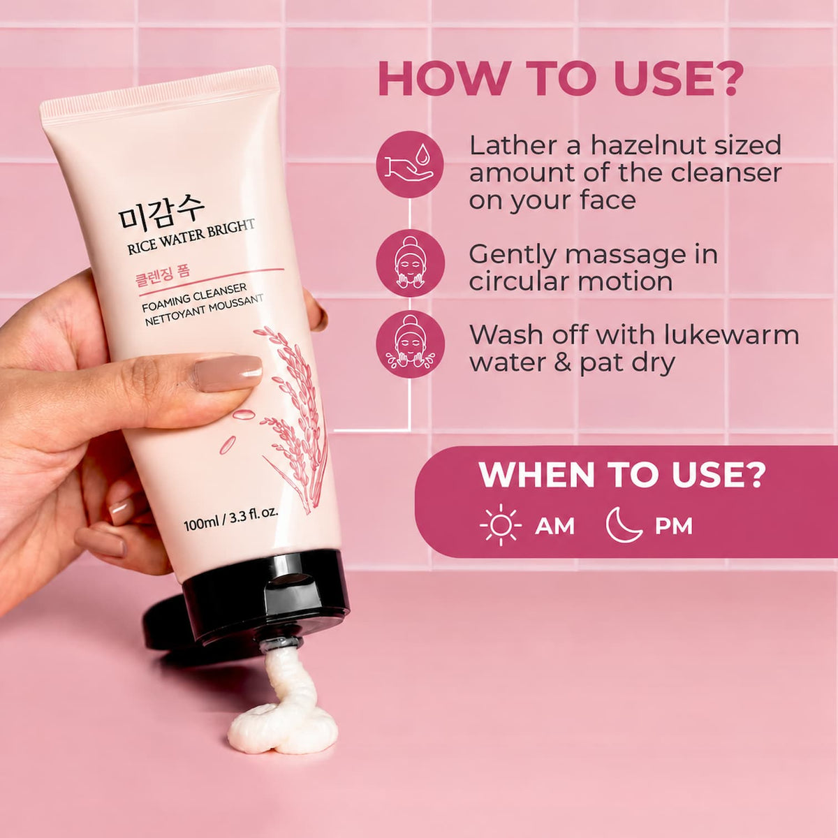A hand holds a tube of RICE WATER BRIGHT Foaming Cleanser, dispensing white foam onto a pink surface. The background is pink with instructional text and icons detailing how to use the cleanser.
