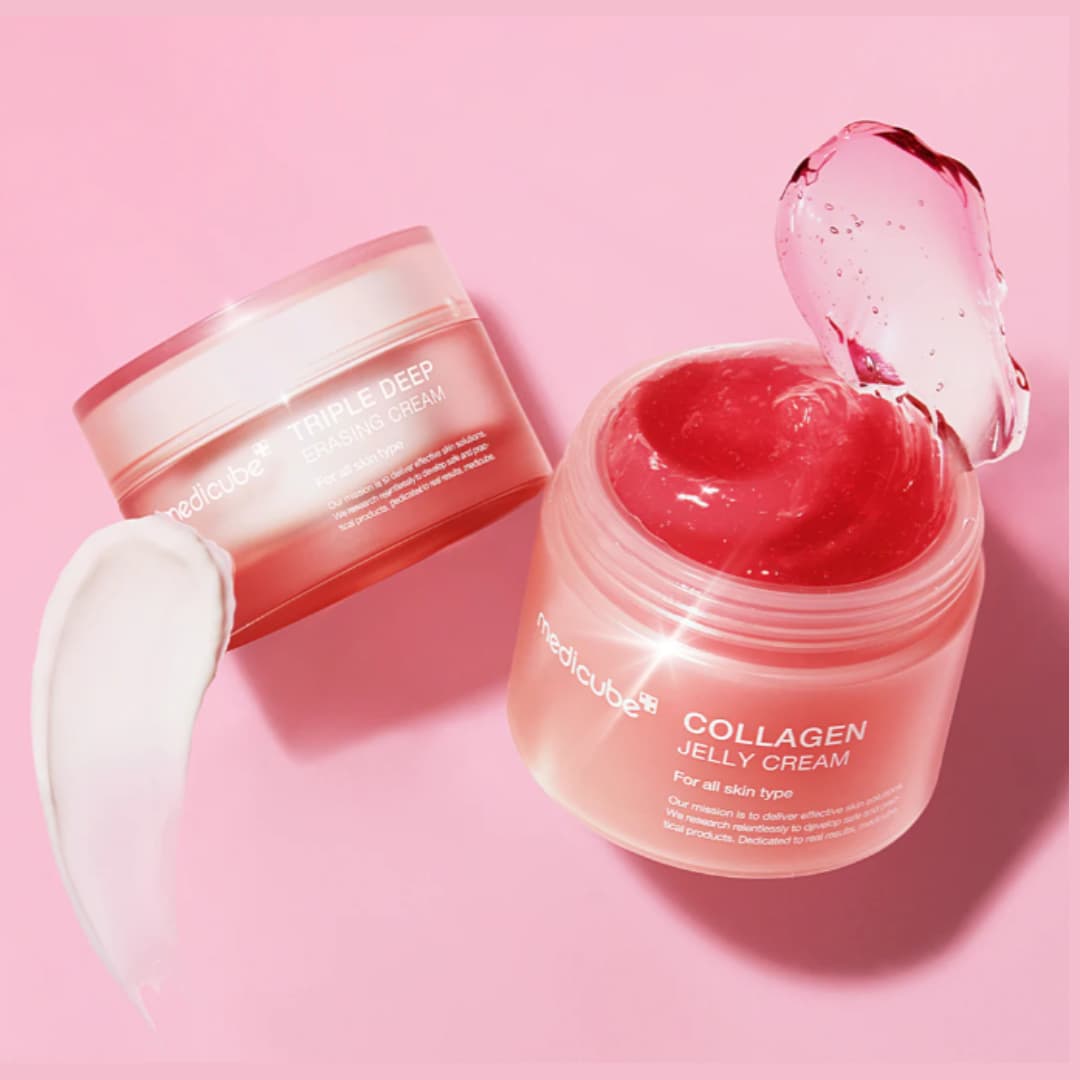two jars of medicube collagen cream on pink background